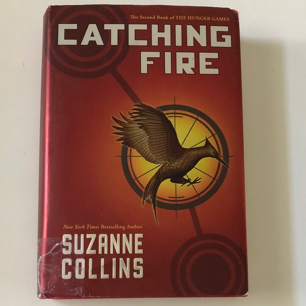 Catching Fire by Suzanne Collins - Red & Gold Hardcover